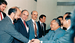 Pier Oddone exchanges greetings with Premier Deng Xiaoping