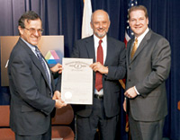 Jack Lavin, Director of the Illinois Department of Commerce and Economic Opportunity, Fermilab director Pier Oddone, and Argonne director Rob Rosner