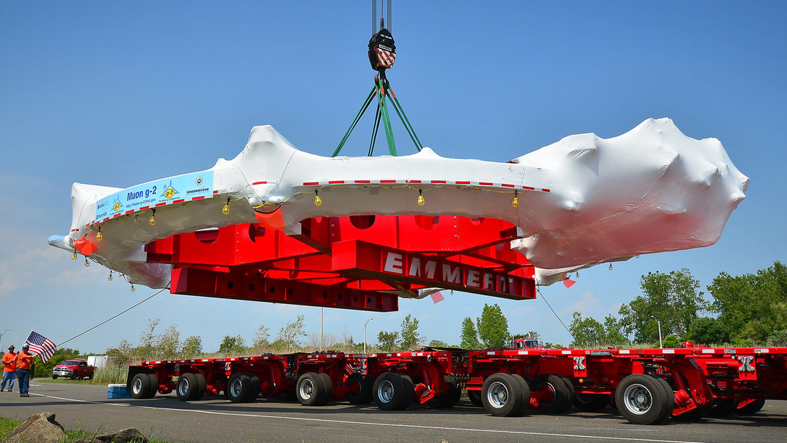 Photo of workers used a massive crane to move the Muon g-2 electromagnet from the trailer of a specially adapted truck