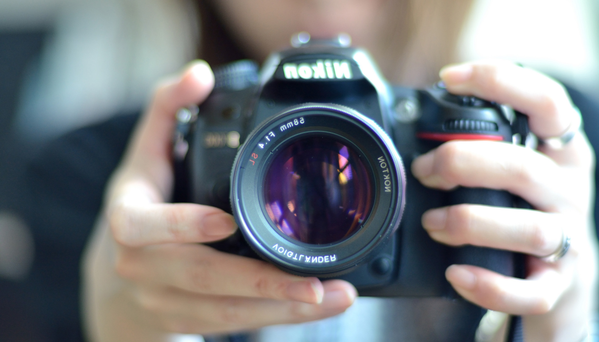 Image of person holding a camera