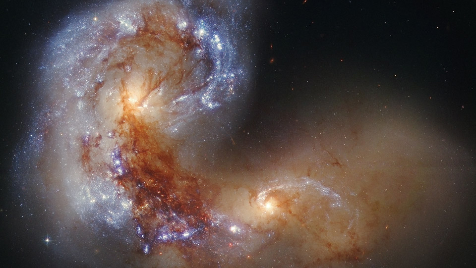 Spiral Galaxy NGC 4038 in Collision | symmetry magazine