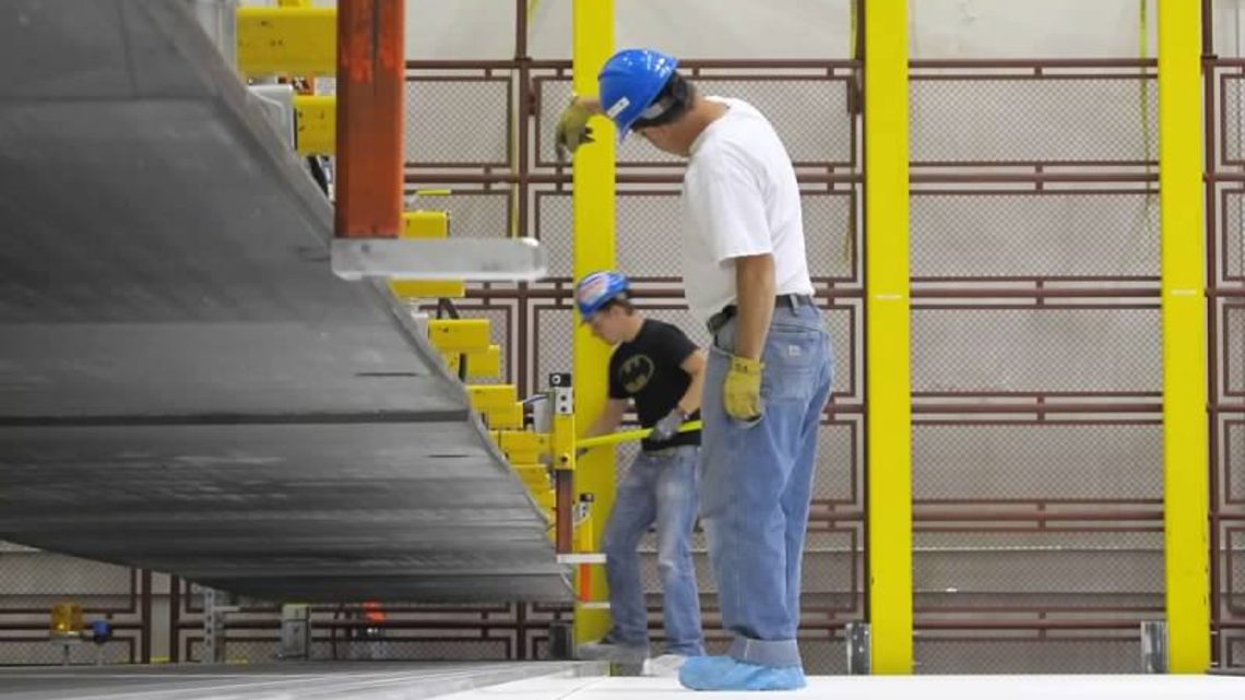 Photo of two men working on NOvA Construction