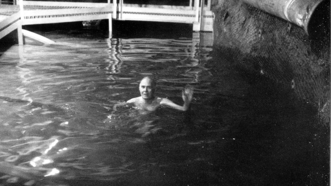 Ray Davis enjoys a swim at 4850 feet underground. He flooded the cavern to reduce backgrounds for the experiment.