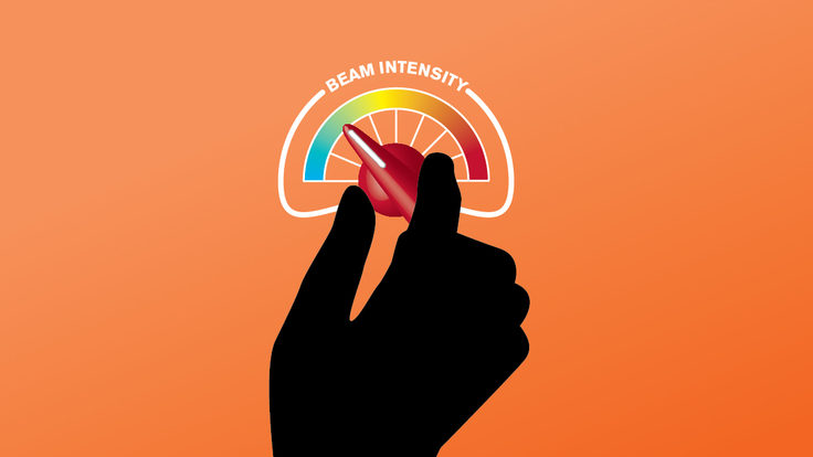 Illustration of persons hand turning up "beam intensity" dial